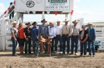 Josh Reynolds shown with people who donated the trophy saddle