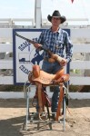 Josh Reynolds with rifle and saddle